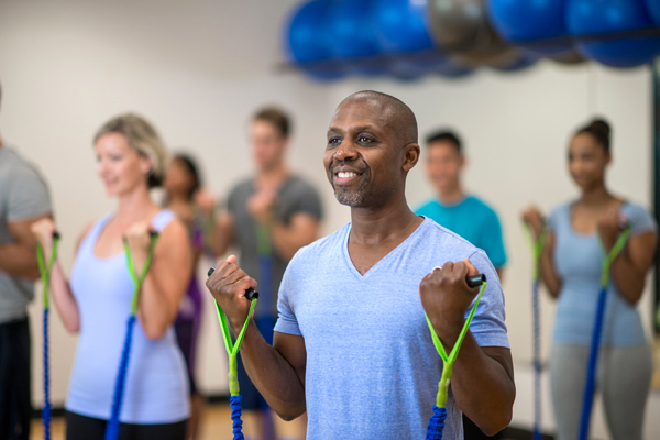 man exercising with bands man exercising with bands