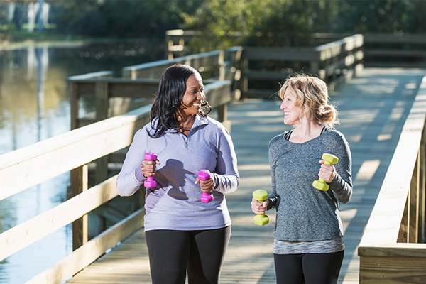 exercising through cancer women walking with weights